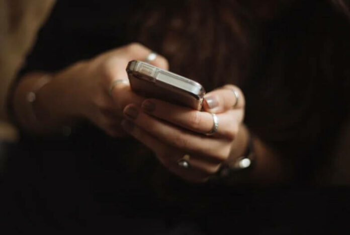 Text messaging on mobile telephone.