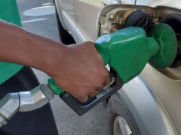Car refueling at gas pump