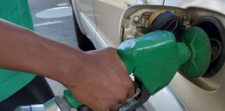 Car refueling at gas pump