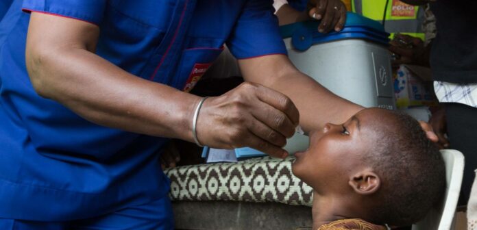 Child Receiving the Polio vaccine Child Receiving the Polio vaccine