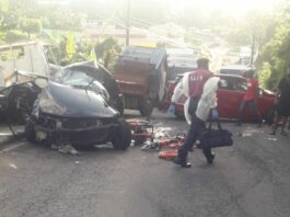 Emergency responder at scene of road accident in Mon Repos.