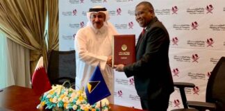 Alva Baptiste signs air services agreement with Qatar