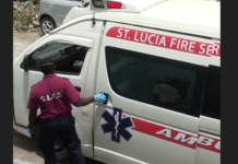 Emergency responder closes ambulance door