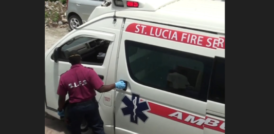Emergency responder closes ambulance door