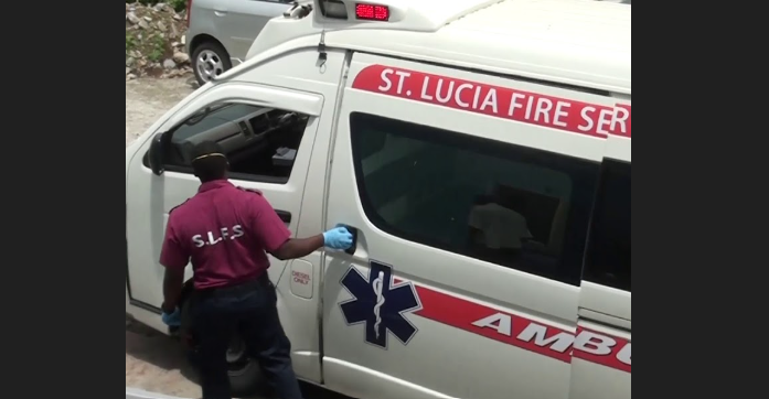 Emergency responder closes ambulance door