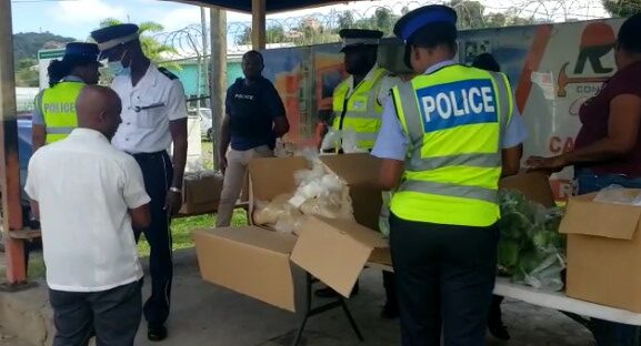 Babonneau police prepare to distribute food hampers to motorists.