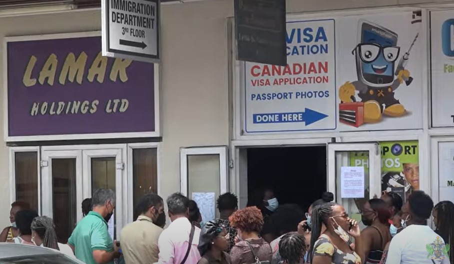 People Standing In Line For Others Becoming A Little Business At   Immigration Department 