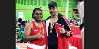 Saint Lucian light heavyweight boxer, Nikaela Khodra, left, with Trinidadian opponent, Leeann Boodram, following their February 19 bout in Georgetown, Guyana.