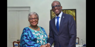 Prime Minister Philip J. Pierre shakes hands with the Director General of the WTO.
