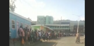 Stranded commuters at Gros Islet bus stand in Castries.