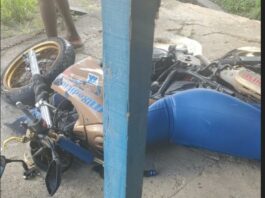 Motorcycle on the ground after collision with car at Odsan.