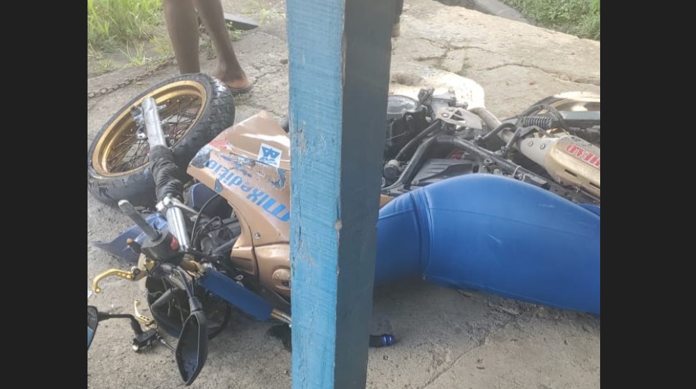 Motorcycle on the ground after collision with car at Odsan.