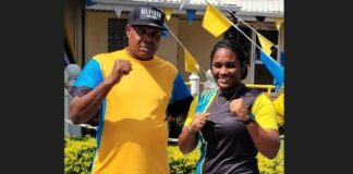 PHOTO: Saint Lucian light heavyweight boxer, Nikaela Khodra, right, with National Head Boxing Coach, Conrad Fredericks.