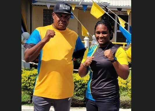 PHOTO: Saint Lucian light heavyweight boxer, Nikaela Khodra, right, with National Head Boxing Coach, Conrad Fredericks.