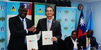 His Excellency Peter Chia-yen Chen, Taiwan’s Ambassador to Saint Lucia, and Hon. Moses Jn. Baptiste, Minister for Health, Wellness and Elderly Affairs, shake hands after signing the MoU on public health.