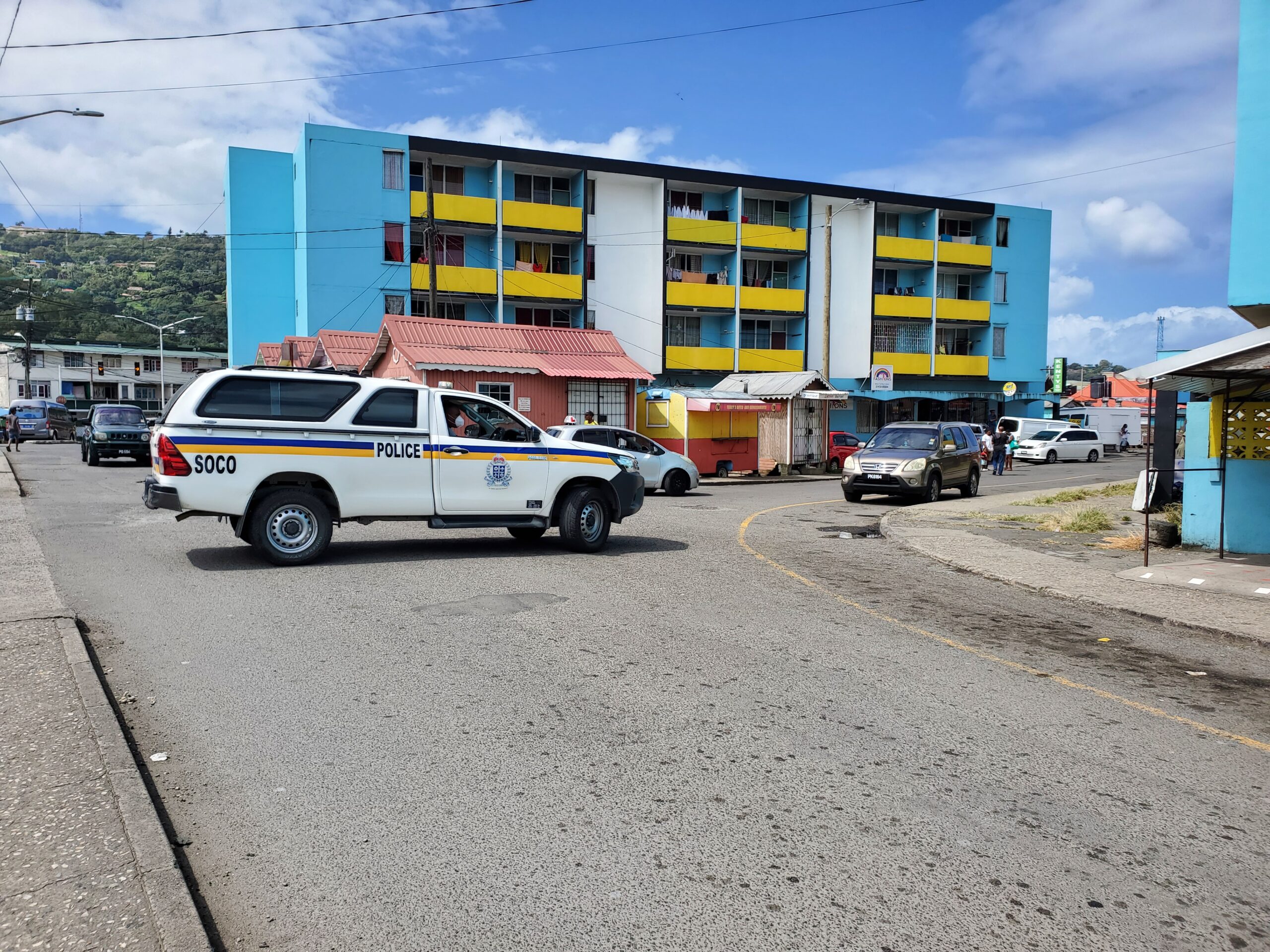 Police vehicle parked at scene of Darling Road, Castries shooting.