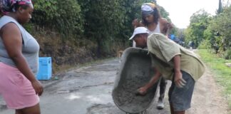 Bouton residents engage in self-help road repairs.