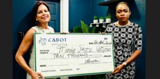 Cabot representative presents $10,000 jazz sponsorship cheque.