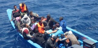 Stranded migrants aboard vessel in Caribbean sea.