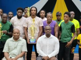 Prize winners in Gros Islet beach football competition pose with their prizes.