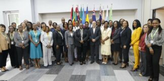 OECS Social Development Ministers and other officials pose for photo during their meeting in Antigua.