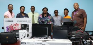 Saint Lucia Health Ministry officials pose with communication equipment received from PAHO.
