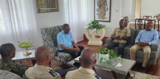 Prime Minister Philip J. Pierre sits down with visiting regional security chiefs for a briefing.
