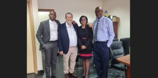 Vincentian Prime Minister Dr. Ralph Gonsalves poses with 1st National Bank officials during their visit to his country.