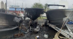Charred ruins of boats destroyed by fire at Gros Islet