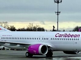 Caribbean Airlines jet on airport runway.