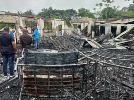 Charred ruins of girls' dormitory after deadly Mahdia fire in Guyana.