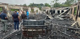Charred ruins of girls' dormitory after deadly Mahdia fire in Guyana.
