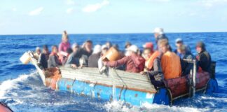 Boat at sea overloaded with illegal migrants.