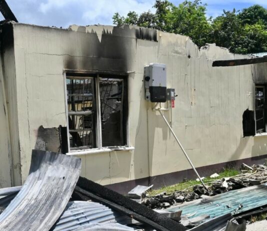 Charred ruins of Mahdia Secondary School dormitory fire in Guyana.