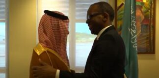 Prime Minister Philip J. Pierre greets visiting Saudi Minister.