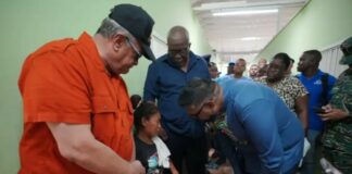 Guyana President Irfaan President Ali consoles grieving parent after deadly school dormitory fire.