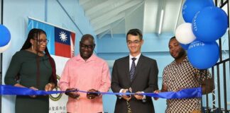 PHOTO: (from left to right): Dr. Cadelia Ambrose, Permanent Secretary in the Department of Housing and Local Government; Hon. Moses Jn. Baptiste, Minister for Health, Wellness, and Elderly Affairs; His Excellency Peter Chia-yen Chen, Taiwan’s Ambassador to Saint Lucia; and Mr. Yondon James, Deputy Chairman of the Vieux Fort North Constituency Council, cut the ceremonial ribbon to officially open the new SMART classroom.