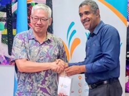Taiwan official receives gift on visit to Saint Lucia Youth Economy Agency.