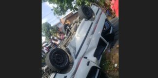 Overturned bus in drain after running off the road at Ciceron, Castries.