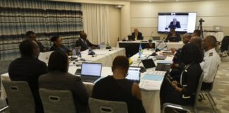 Officials at round table meeting on OECS Customs union.