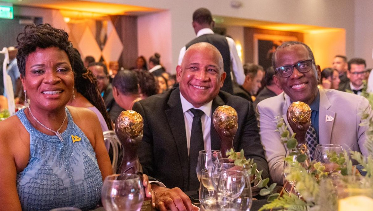 Pierre, Hilaire and SLTA CEO with awards