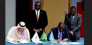 Prime Minister Philip J. Pierre signs an agreement with the Saudis for financing of the St Jude Hospital reconstruction.