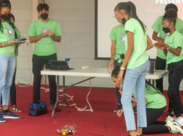 Student teams present their electronics project, The Harmonicar, controlled by the frequency of an acoustic tone. Left to right: Kerese Cozier from Bequia (the Grenadines), Hrishikesh Srinivasan from Nevis, Alannah Bousquet from St. Lucia, Taeija-Lee Hall-Watts (kneeling) from Jamaica, and Rheanna Robinson from Jamaica,