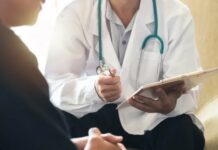 Patient consults with doctor.