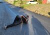 Gros Islet MP Kenson Casimir lying on a newly paved road in his constituency.