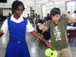 PHOTO: A Taiwan Youth Ambassador shares the secrets to his special talent with a student at St. Joseph’s Convent.
