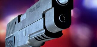 Pistol against purple background.