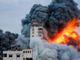 Explosion at building in the conflict between Israel and Hamas.