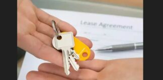 Tenant lease agreement on table as keys to rented building is about to change hands.