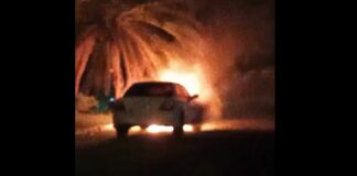 White Subaru on fire at Gros Islet.